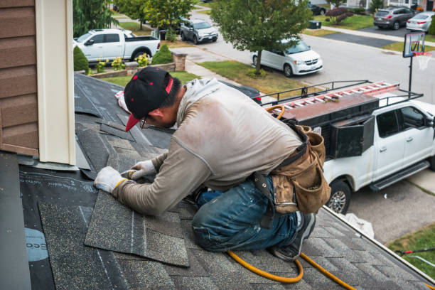 Professional Roofing technician working in Massapequa Park, NY